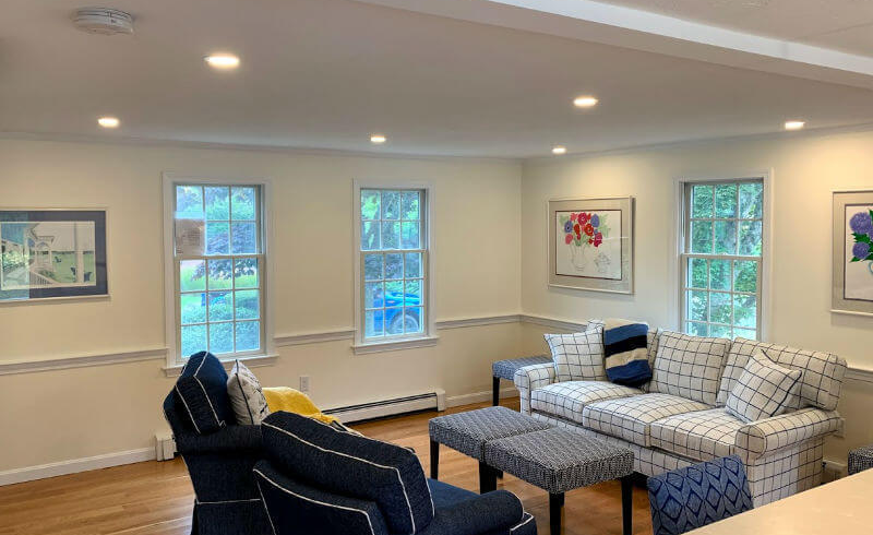 Recessed ceiling lights installed by Aidan Casey Electric in a finished living room
